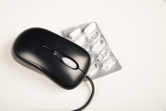 Pills and computer mouse