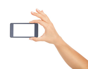 Female hand showing smartphone of white screen, front view, isolated.