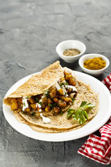 Indian pancakes with potato and spices