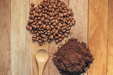 Coffee Residue and Coffee been,Spoon on wooden background