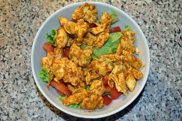 Delicious homemade spicy and healthy chicken salad  for recovery after workout.