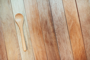 wooden spoon with wooden background