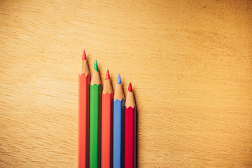Obraz premium Crayons pencils on wooden background