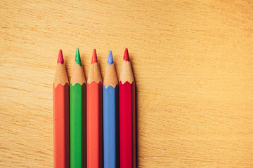 Obraz premium Crayons pencils on wooden background