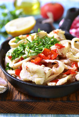 Seafood ragout with vegetables and herbs.