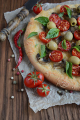 Mushroom pizza with cherry tomatoes and basil