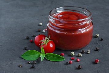 Tomato sauce and basil in glass jars