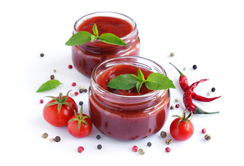 Tomato sauce and basil in glass jars