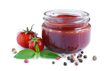 Tomato sauce and basil in glass jars