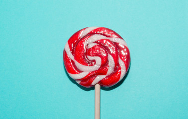 Lollipops candy on blue background. Funny concept. Image with copy space.