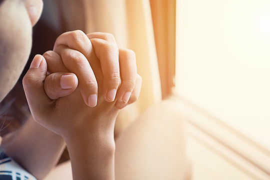 Girl Praying With Hands Close Up,vintage Effect,soft Focus.