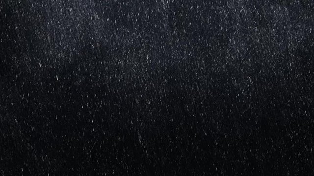 Falling raindrops footage animation in slow motion on dark black background with fog, lightened from top, seamlessly looped rain animation, perfect for film, digital composition, projection mapping