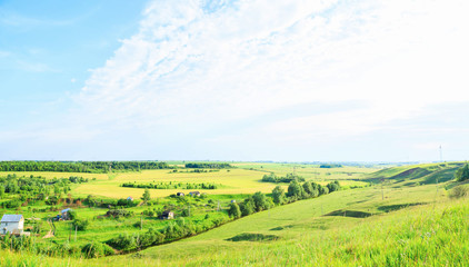 Fototapeta na wymiar countryside in Russia, fields and cottage. Panorama.