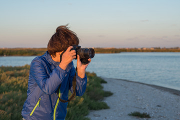 Obraz premium Active woman with camera