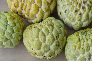sugar apple tropical fruit on wooden board