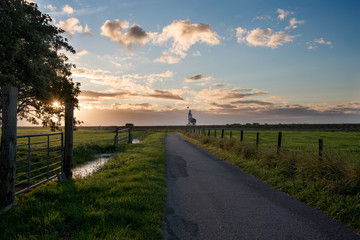 Road leading to the Lighthouse at sunrise, Marken, The Netherlands