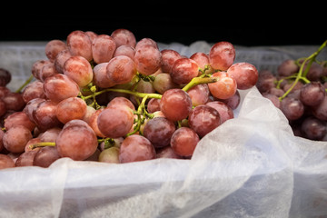 Grapes on bucket in the market.