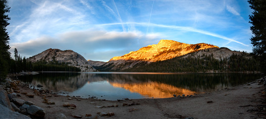 Clear lake with reflection when entering Yosemite NP through the Tioga Pass, USA