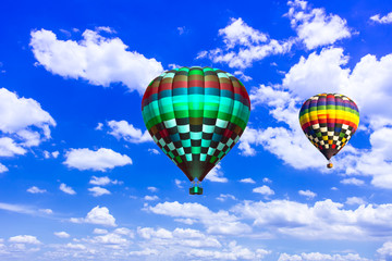Fototapeta premium balloon Beautiful colorful hot air balloon flying in the vast sk