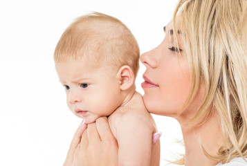 Mother and baby playing and smiling. Happy family.