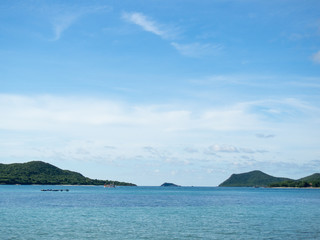 blue sea and mountain with beautiful sky background