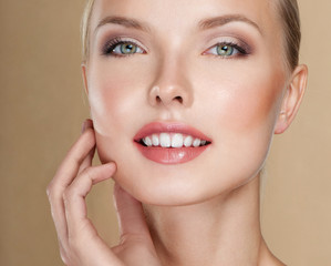 Fototapeta premium Beautiful face of young adult woman with clean fresh skin.