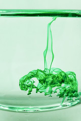 color drop in water, photographer in motion. Ink swirling in water. Cloud of silky ink in water. Colorful ink in water, ink drop. Action painting