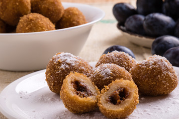plum dumplings on white plate