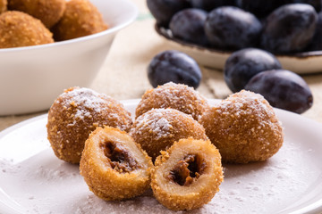 plum dumplings on white plate