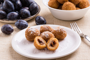 plum dumplings on white plate