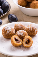 plum dumplings on white plate