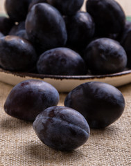 fresh healthy plums on table