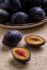fresh healthy plums on table