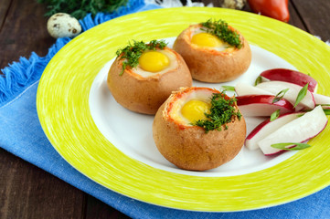 Baked small flavorful bun with bacon, cheese, quail egg and greens. Tasty breakfast.