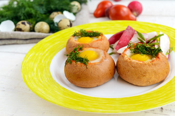 Baked small flavorful bun with bacon, cheese, quail egg and gree