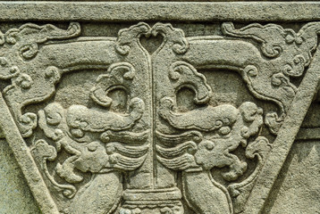 Dragons bas-reliefs in an ancient sculpture in the park ;Gardens by the ; of Singapore