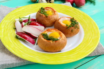 Baked small flavorful bun with bacon, cheese, quail egg and greens. Tasty breakfast.