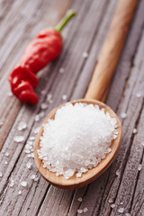 Salt crystals in a wooden spoon