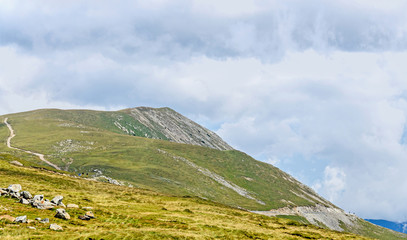 Transalpina road, Parang Mountains near clouds, hills with green grass