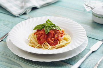 spaghetti amatriciana on a blue wooden table (Italian dish)