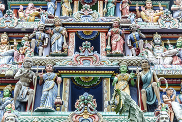 sculptures of gods and goddesses in the gopura of entry to the temple The Sri Mariamman Temple in Singapore