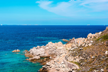 Phot with blue sea and stones on the island