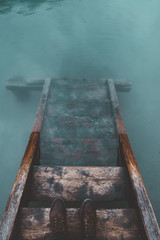wood stair in Braies lake with blue water and boots - 121562198