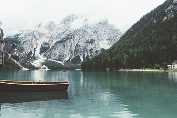 Landscape of Braies lake with boats,mountains, trees - 121562558