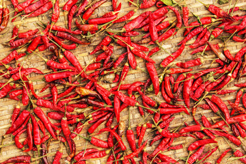 Fototapeta premium Red chili pepper dried. bamboo texture and background
