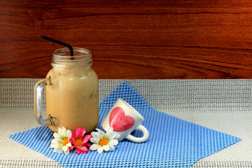 ice latte and bread topped with dried shredded pork and mayonnaise in white trays 