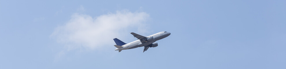 Fototapeta na wymiar plane in the blue sky panorama