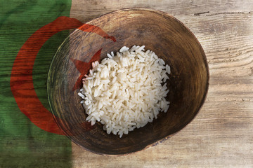 Poverty concept, bowl of rice with Algeria flag