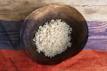 Poverty concept, bowl of rice with Russian flag