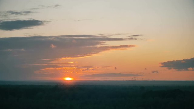 timelapse of sunset over the forest